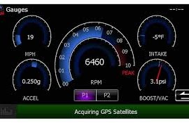Aftermarket radio screen showing live RPM, speed and boost gauges through Maestro
