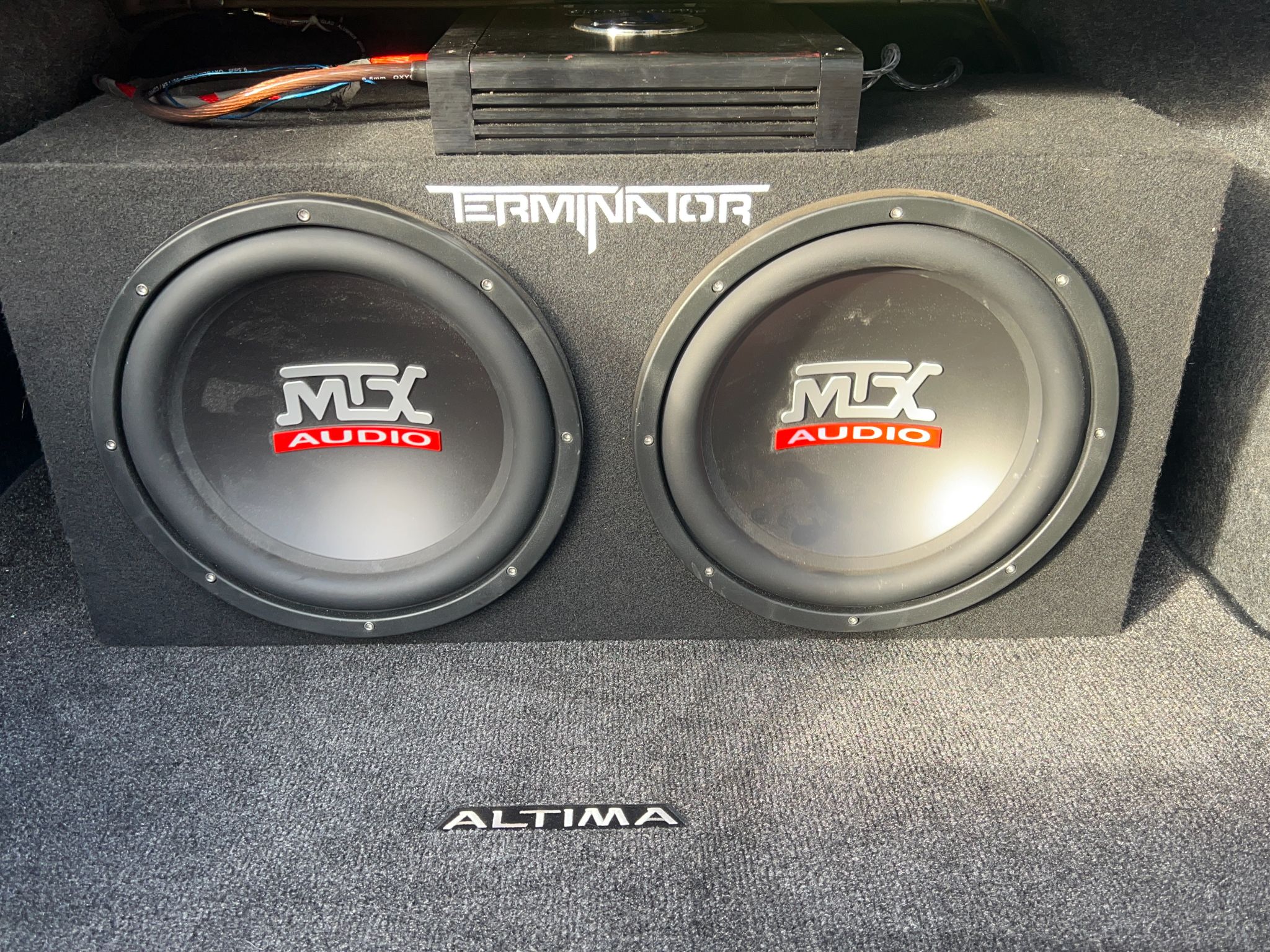 Two MTX subwoofers in a box with a Terminator amp mounted behind, Nissan Altima trunk