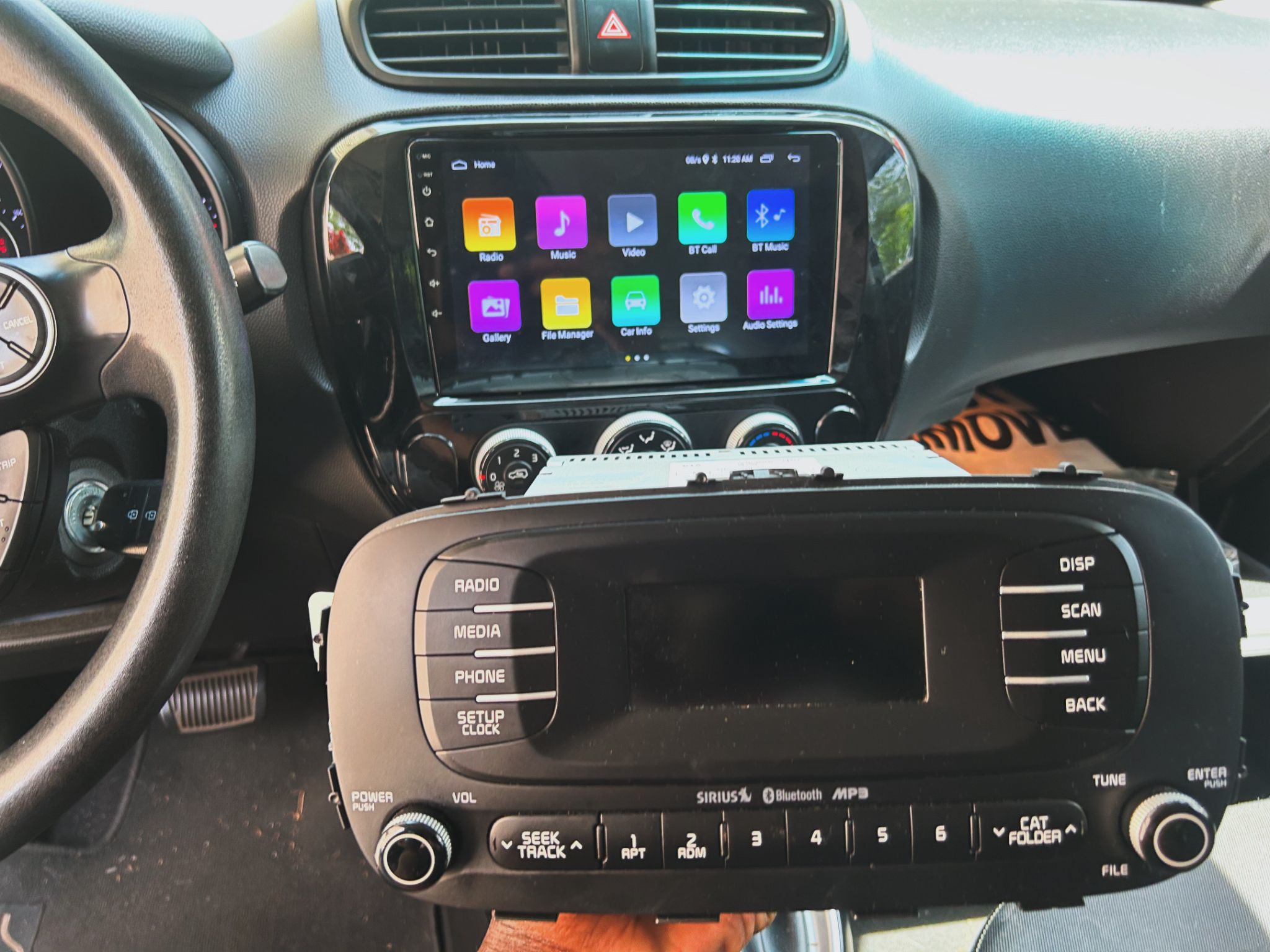 Kia Soul with the factory radio removed and a CarPlay unit installed